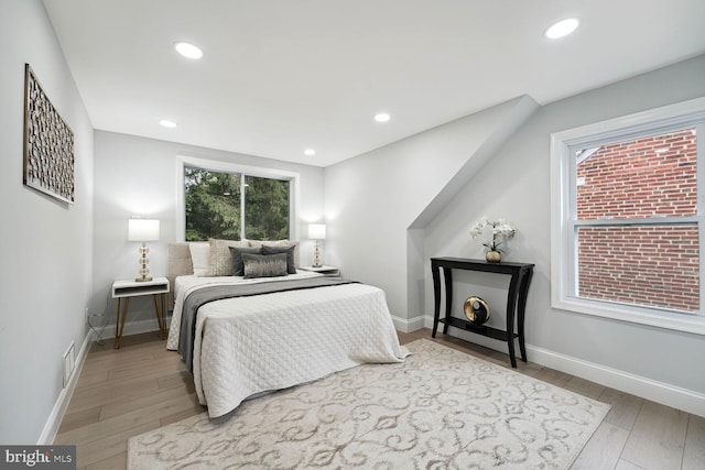 bedroom with hardwood / wood-style floors