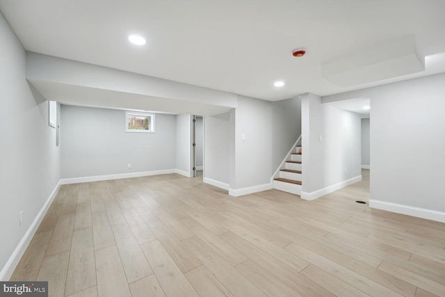 basement featuring light wood-type flooring