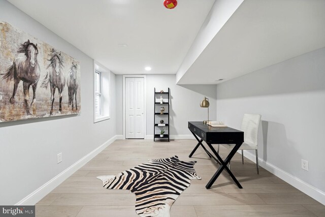 home office with light wood-type flooring