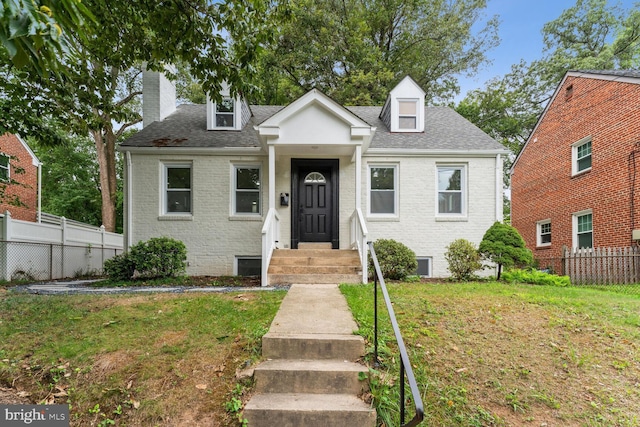 view of front of home with a front lawn