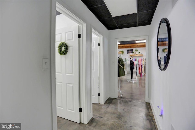 corridor featuring a drop ceiling