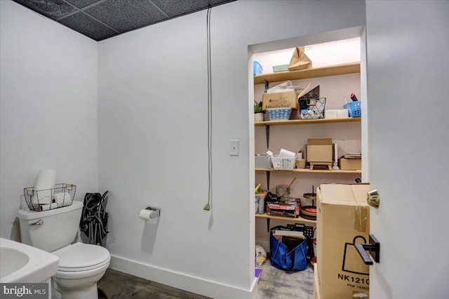 bathroom featuring sink, hardwood / wood-style floors, and toilet