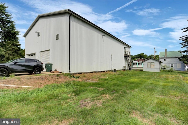 view of home's exterior with a lawn