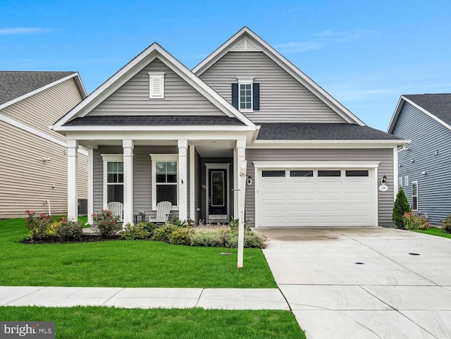 craftsman house featuring a front lawn and covered porch