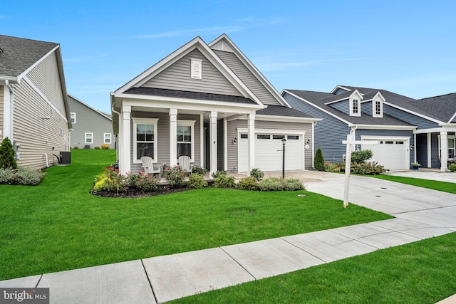 craftsman inspired home with central AC, covered porch, and a front yard