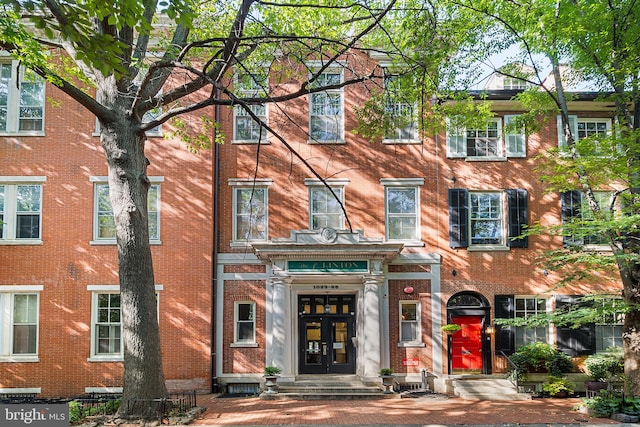 townhome / multi-family property featuring french doors