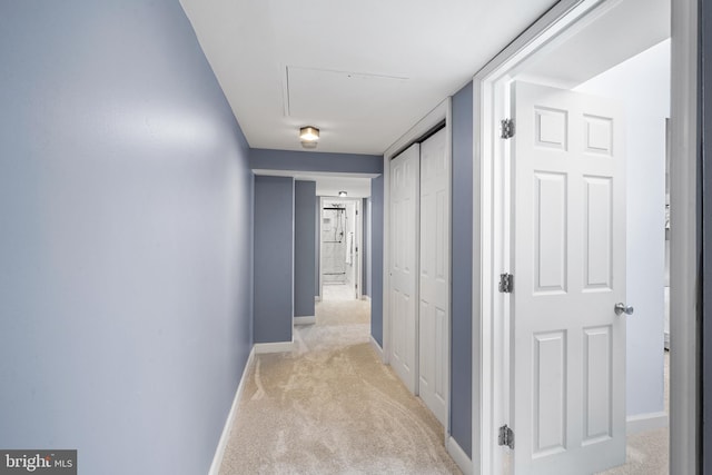 hallway with light colored carpet