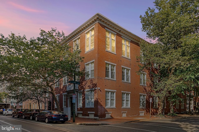 view of outdoor building at dusk