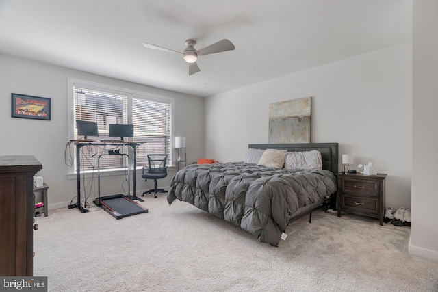 bedroom featuring light colored carpet and ceiling fan