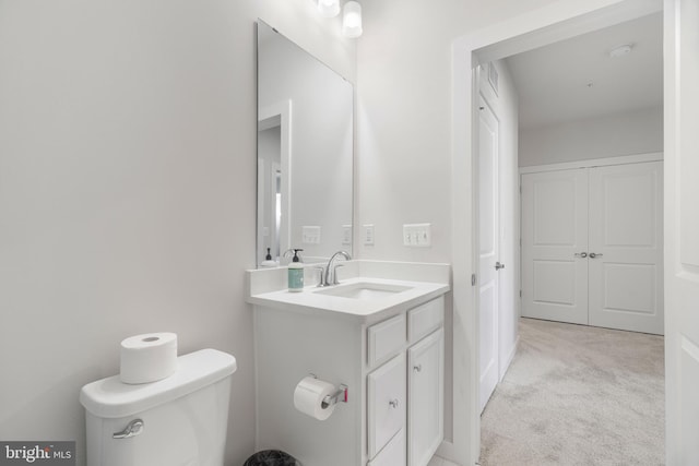 bathroom with toilet and vanity