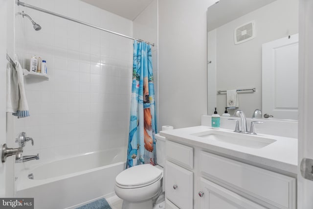 full bathroom with tile patterned flooring, toilet, vanity, and shower / tub combo