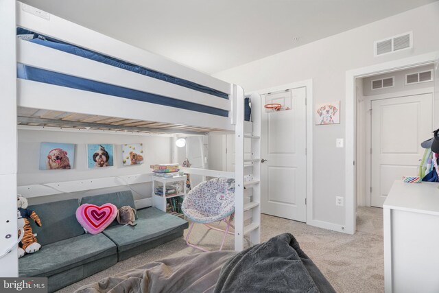 bedroom with light colored carpet