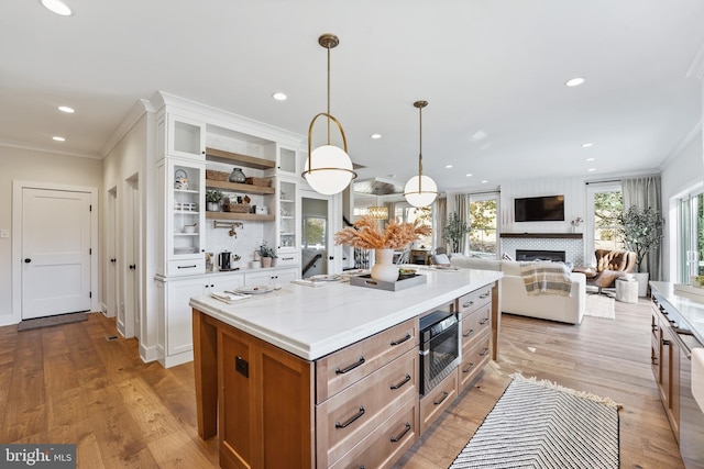 kitchen with white cabinetry, a healthy amount of sunlight, and a center island