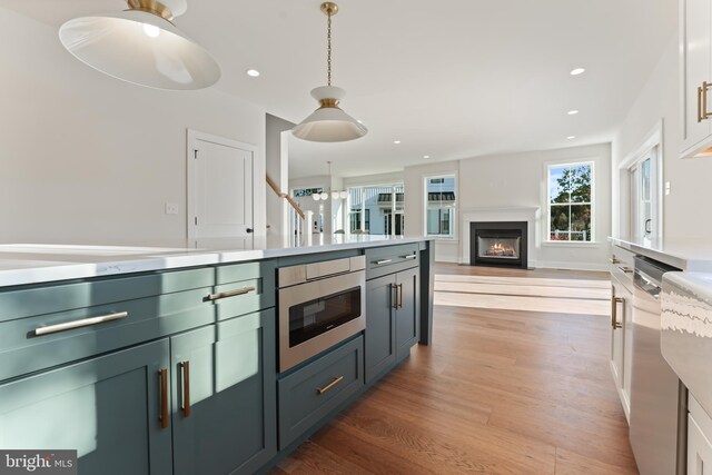 kitchen featuring a center island, white cabinets, and dark hardwood / wood-style flooring