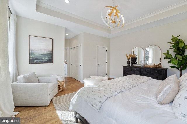 bedroom featuring dark wood-type flooring, crown molding, multiple windows, and ceiling fan