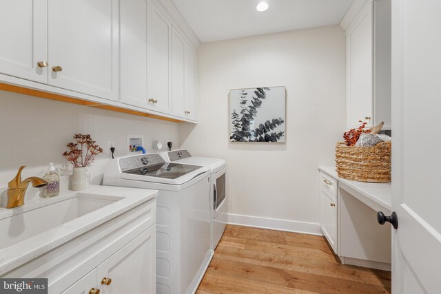 bar with sink, decorative backsplash, light hardwood / wood-style flooring, and beverage cooler