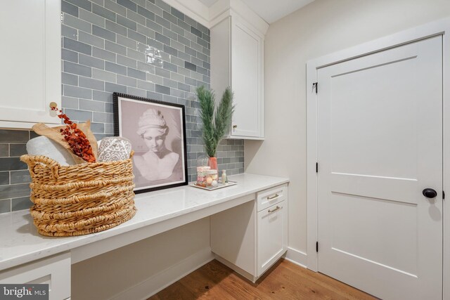 bathroom featuring a shower with door, vanity, and toilet