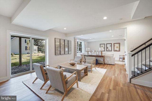 living room featuring light hardwood / wood-style floors and a healthy amount of sunlight