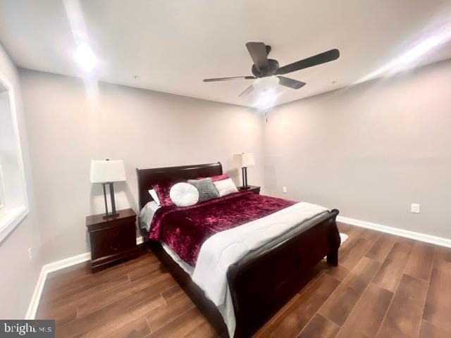 bedroom with ceiling fan and wood-type flooring