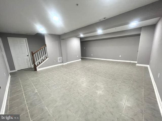 basement featuring tile patterned floors