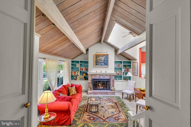 living room featuring lofted ceiling with beams, built in features, a brick fireplace, and wood ceiling