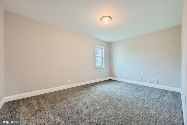 spare room featuring carpet flooring