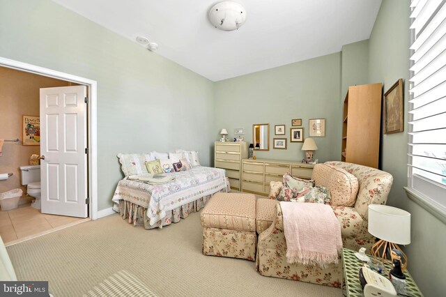 bedroom featuring ceiling fan and light colored carpet