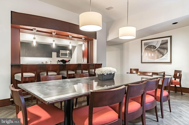 dining space with light parquet floors