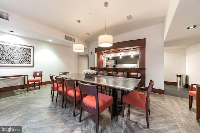 dining room with dark parquet floors