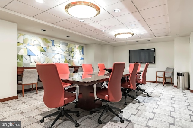 dining room featuring a drop ceiling