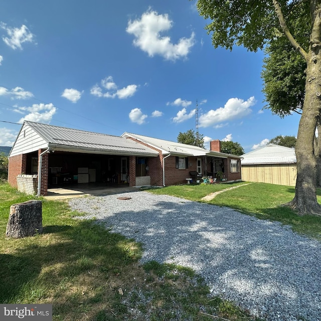 ranch-style house with a front yard