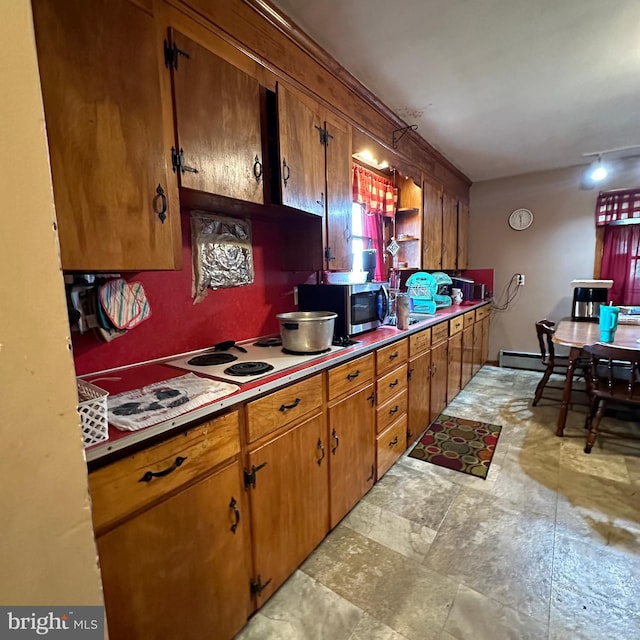 kitchen with light tile patterned floors and white electric stovetop