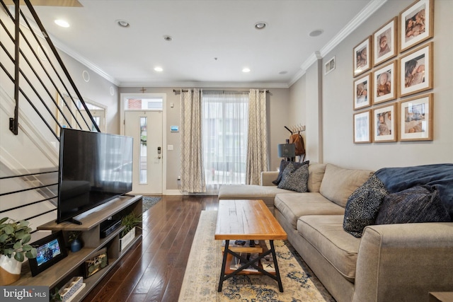 living room featuring ornamental molding and dark hardwood / wood-style floors