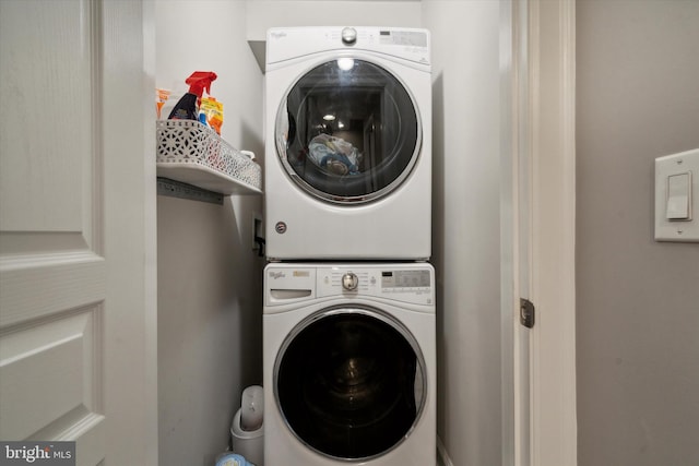 laundry area with stacked washer / drying machine