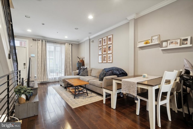 living room with crown molding and dark hardwood / wood-style flooring