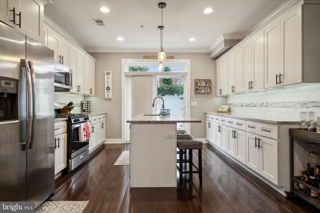 kitchen with light stone countertops, dark hardwood / wood-style floors, stainless steel appliances, and backsplash