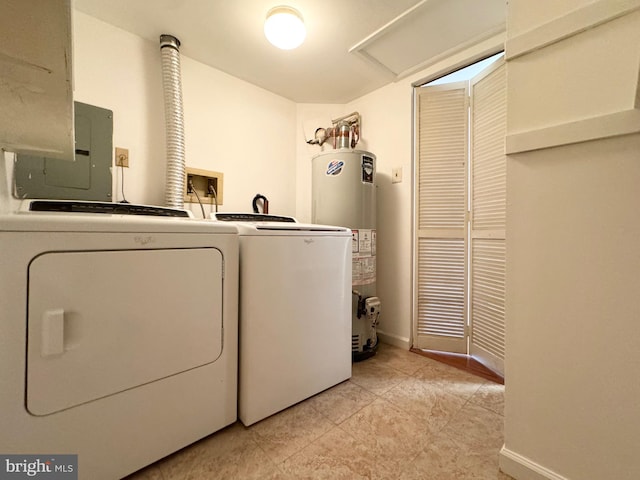 laundry area with separate washer and dryer, light tile patterned floors, and water heater