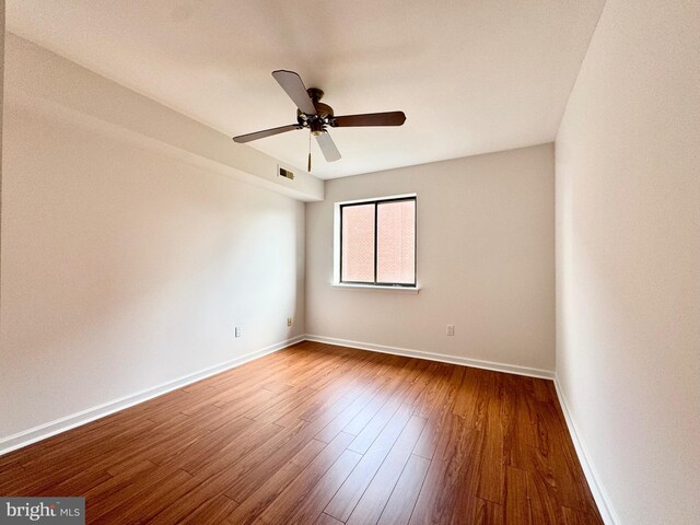 spare room featuring ceiling fan and wood-type flooring