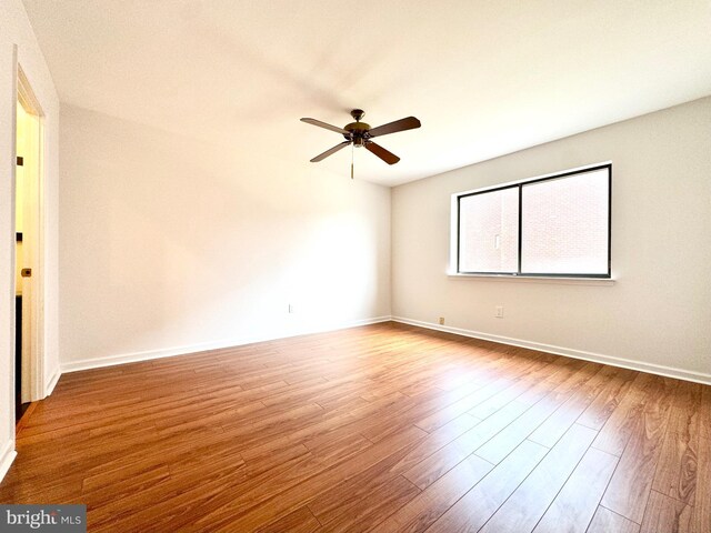 unfurnished room featuring ceiling fan and wood-type flooring