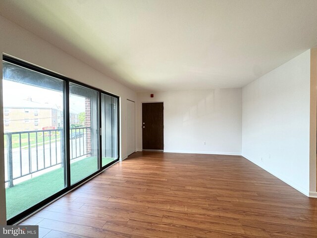 spare room featuring hardwood / wood-style floors