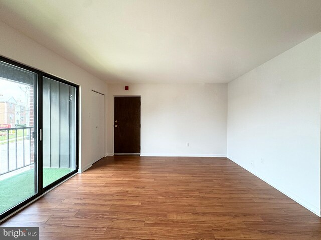 empty room with light hardwood / wood-style floors