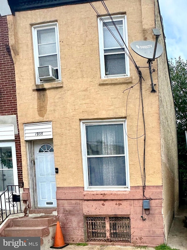 view of front of home featuring cooling unit