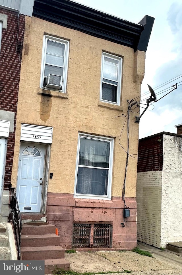 view of front of property with cooling unit