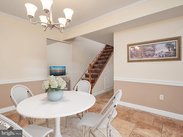 dining area with ornamental molding and an inviting chandelier