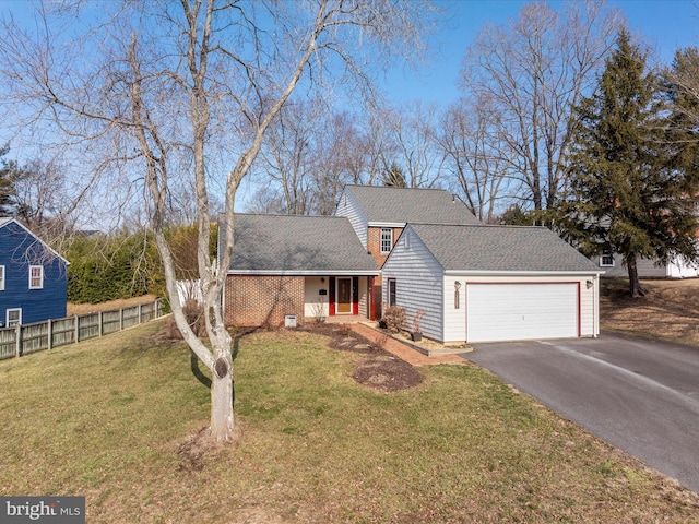 view of front facade featuring a garage and a front yard