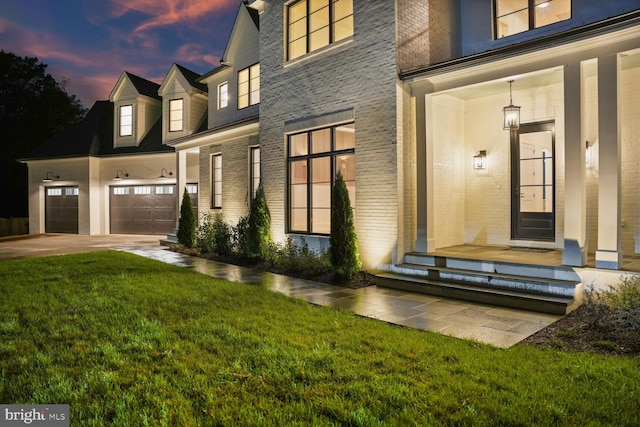 exterior space featuring a yard and a garage