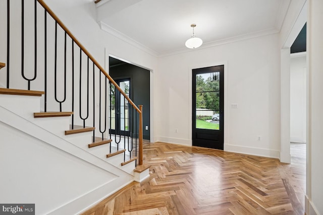 entrance foyer with light parquet floors and crown molding