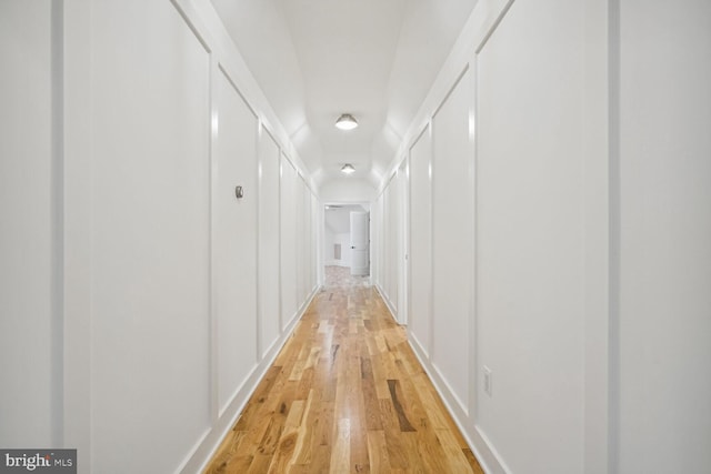 hall with light hardwood / wood-style floors