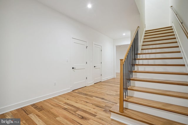 stairway with wood-type flooring