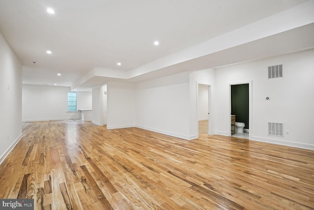 unfurnished living room featuring light wood-type flooring